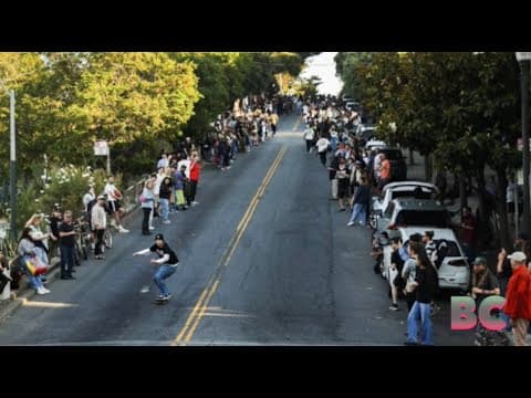Skaters move the hill bomb one block from the barricades