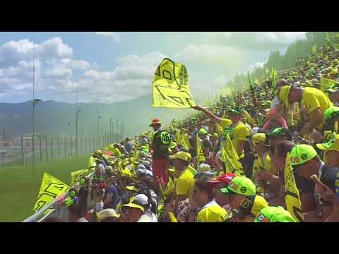 MotoGP Austria 2017 start - VR46 Rossi Fan Club. Yellow flags, yellow smoke, yellow hats.