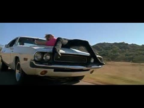 Death Proof: The 1970 Dodge Challenger that Zoë Bell rides on the hood of, name-checked on screen.