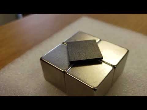 Pyrolytic graphite levitating on four magnets