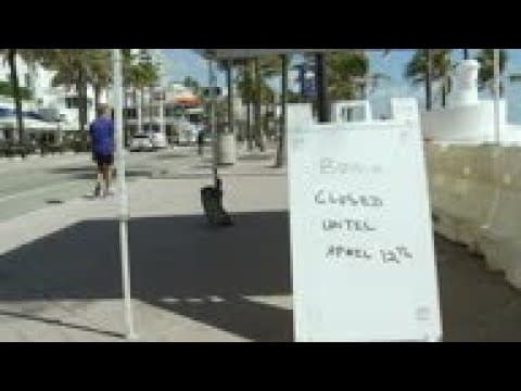 Florida beaches stay busy as the virus spreads
