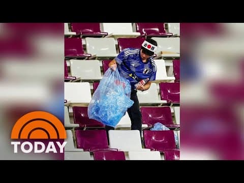 Japanese fans clean the stands