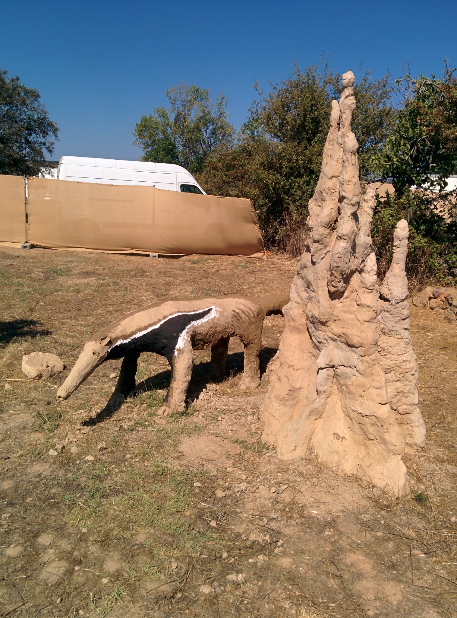 Rammed earth spire sculpture on the ground, Boom 2014