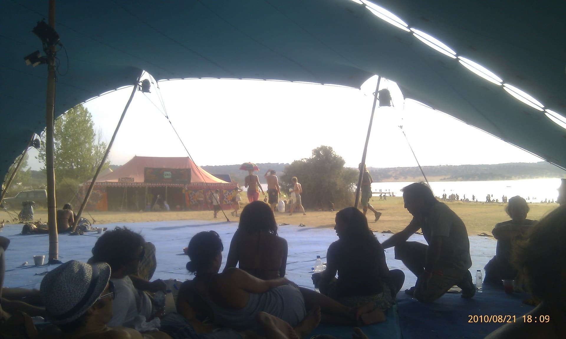 Audience seated under an open sided tent, Boom 2010