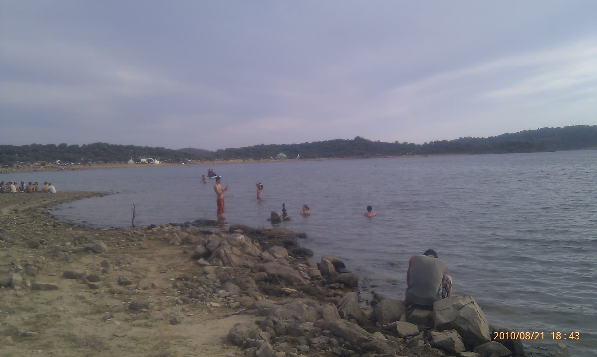 Bathers on the rocky reservoir shoreline, Boom 2010
