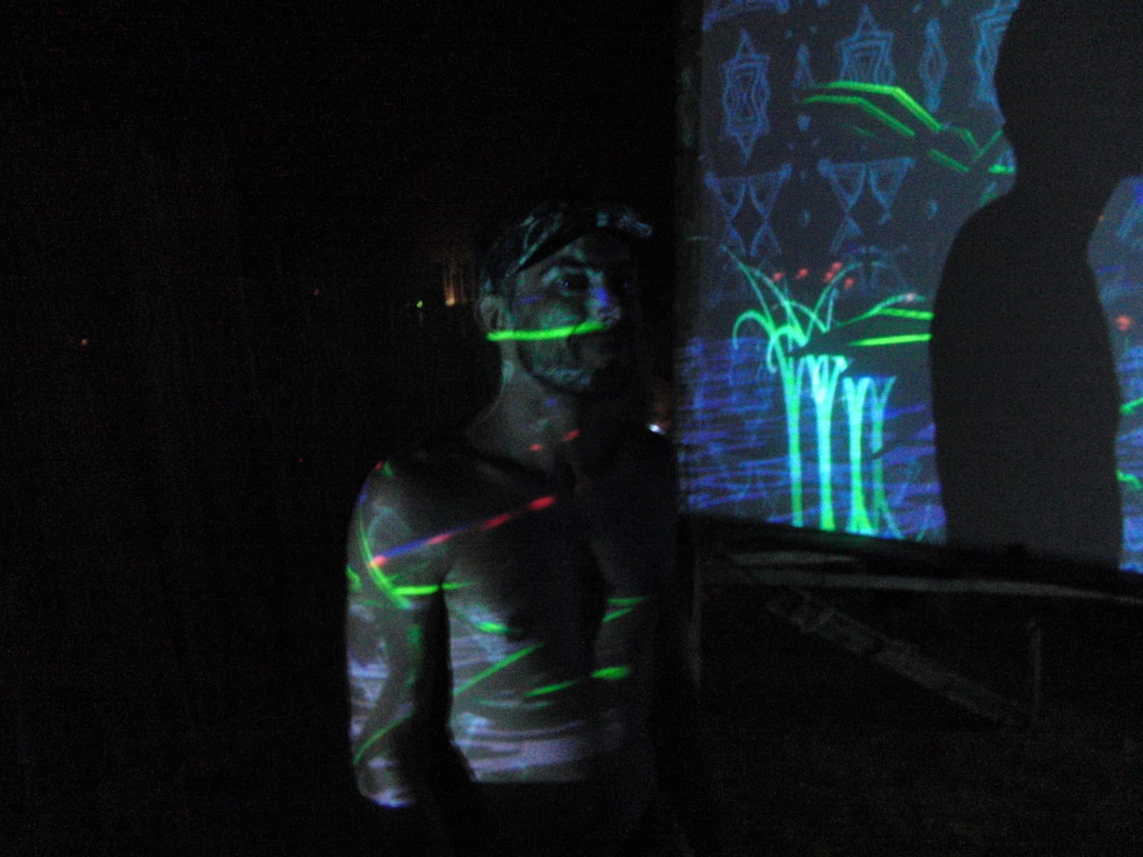 Body painted figure under ultraviolet light, Boom 2010