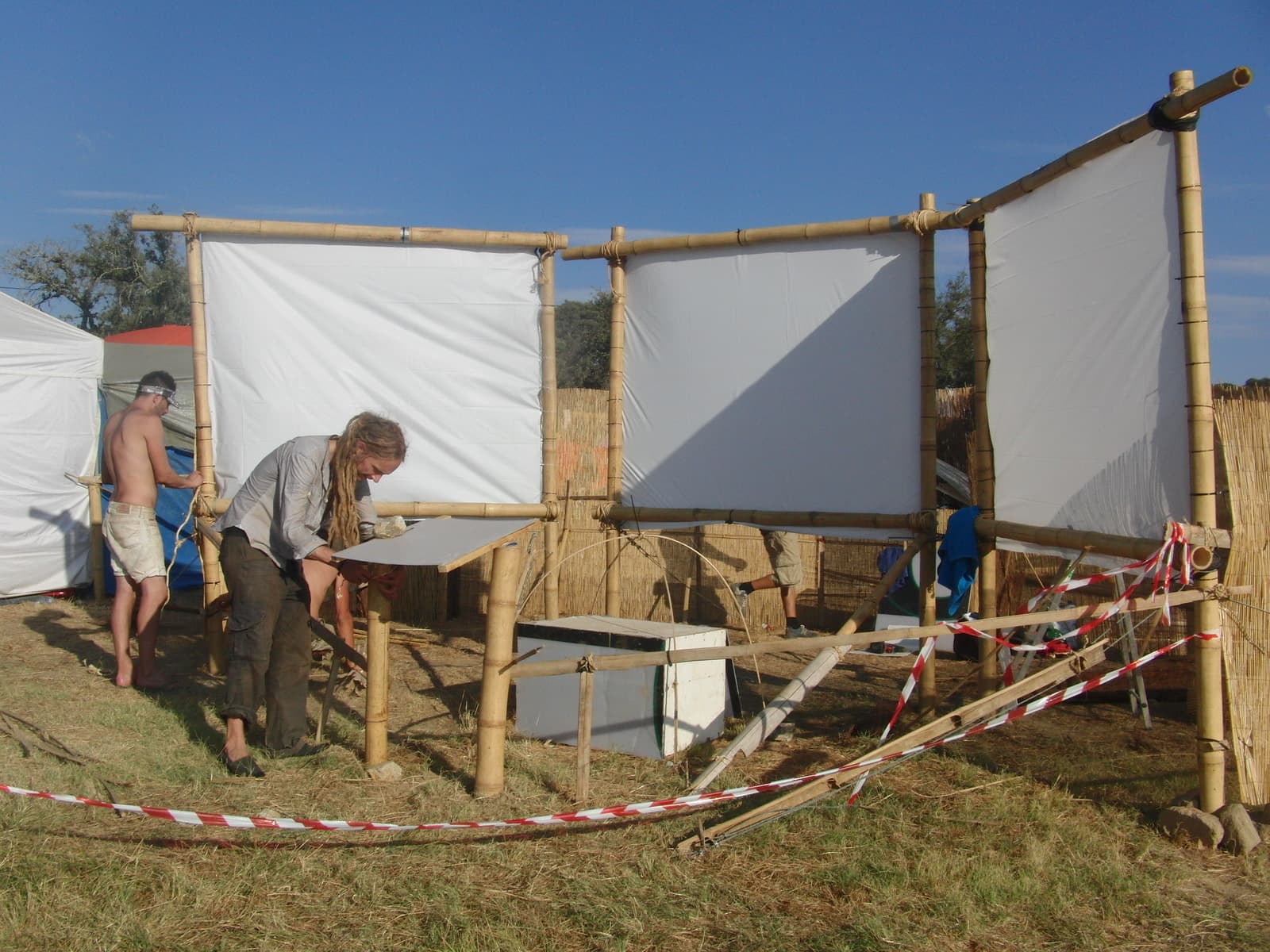 Building the screen frame beside the camp, Boom 2010