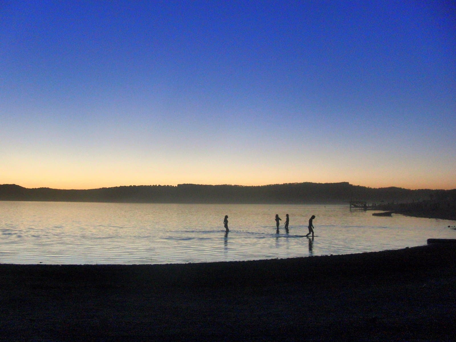 Swimmers wading at dawn on the reservoir, Boom 2010