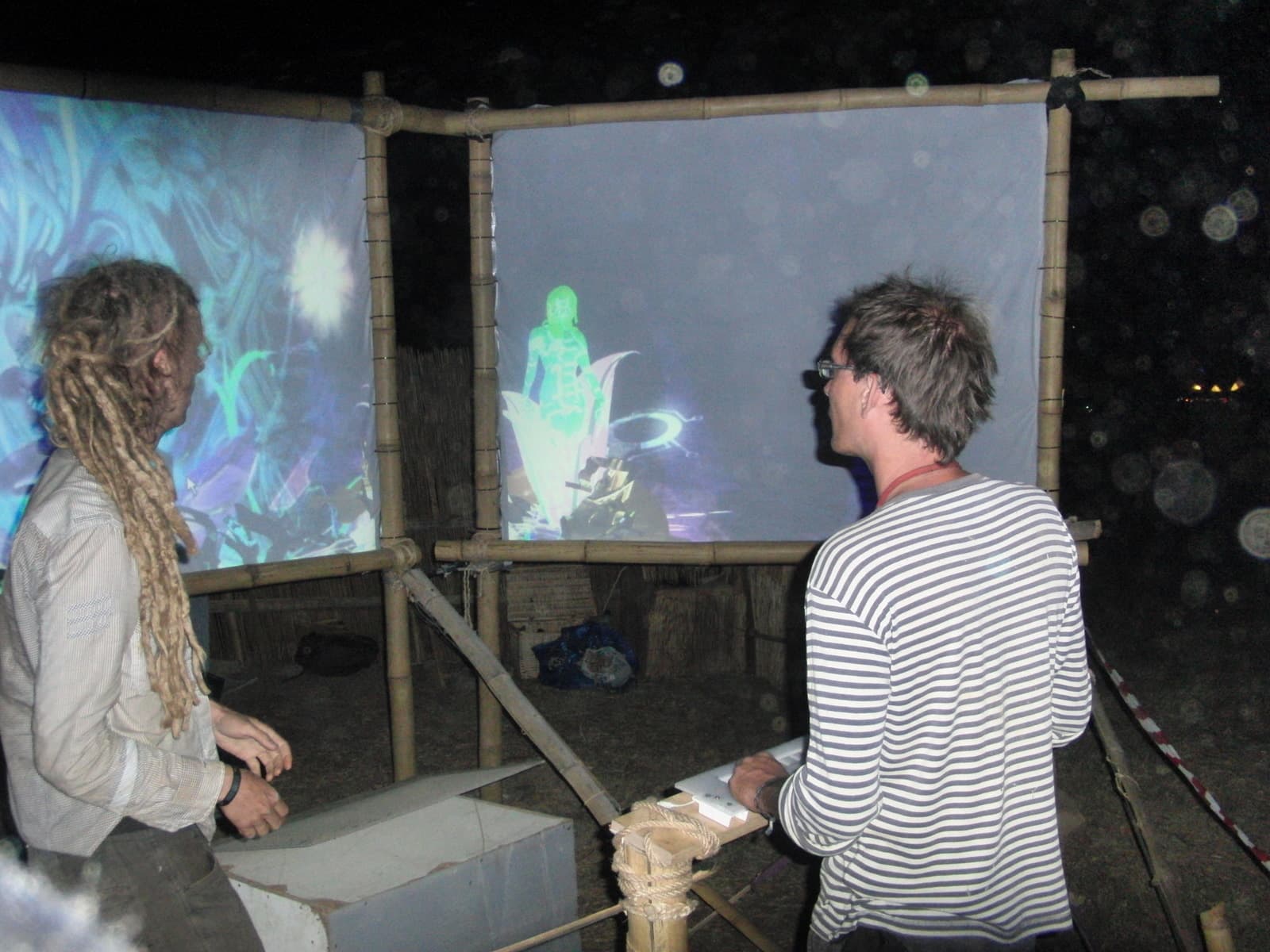 Two visitors before the projection panels, Boom 2010