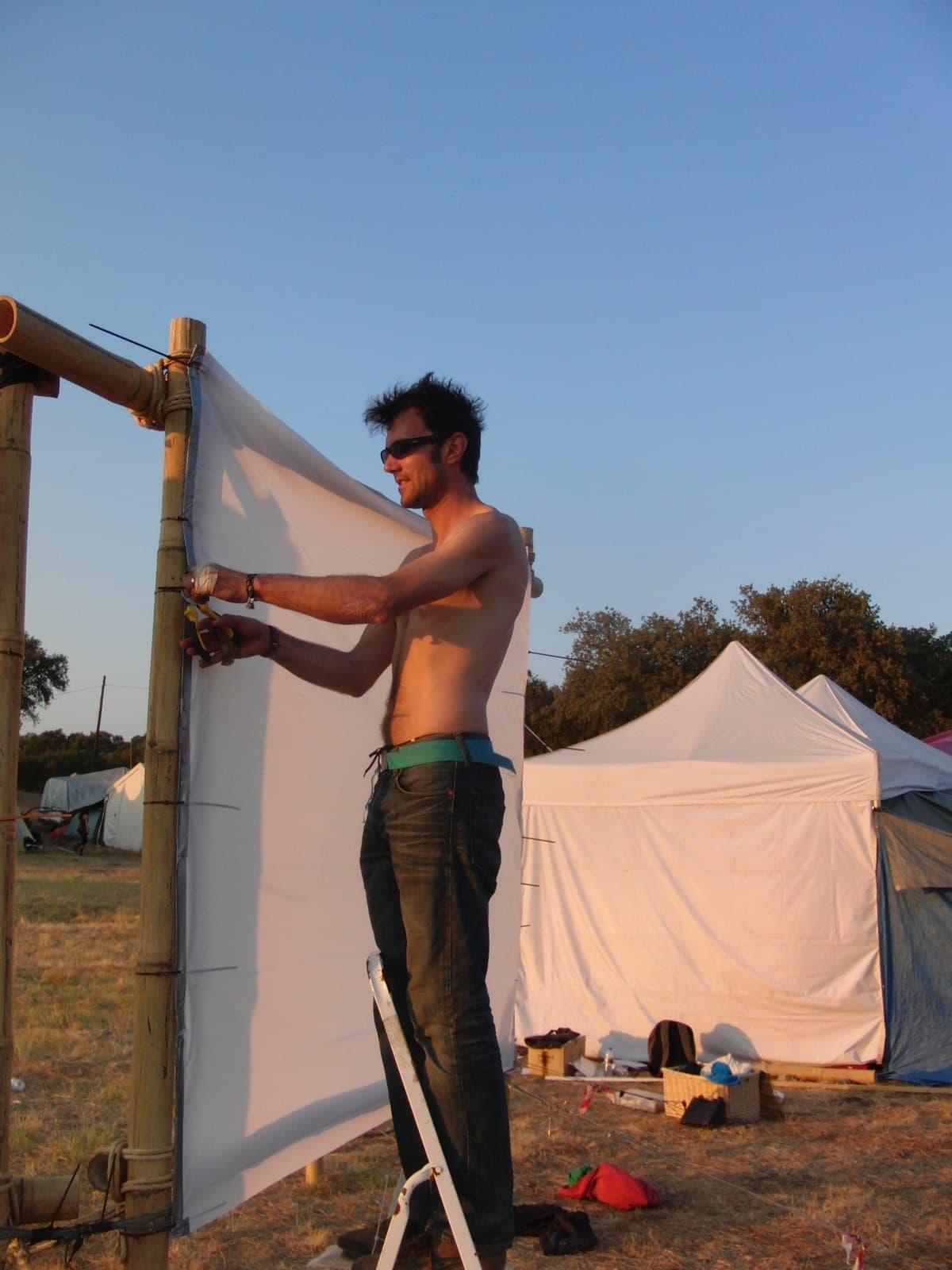Stretching fabric over a bamboo screen frame, Boom 2010