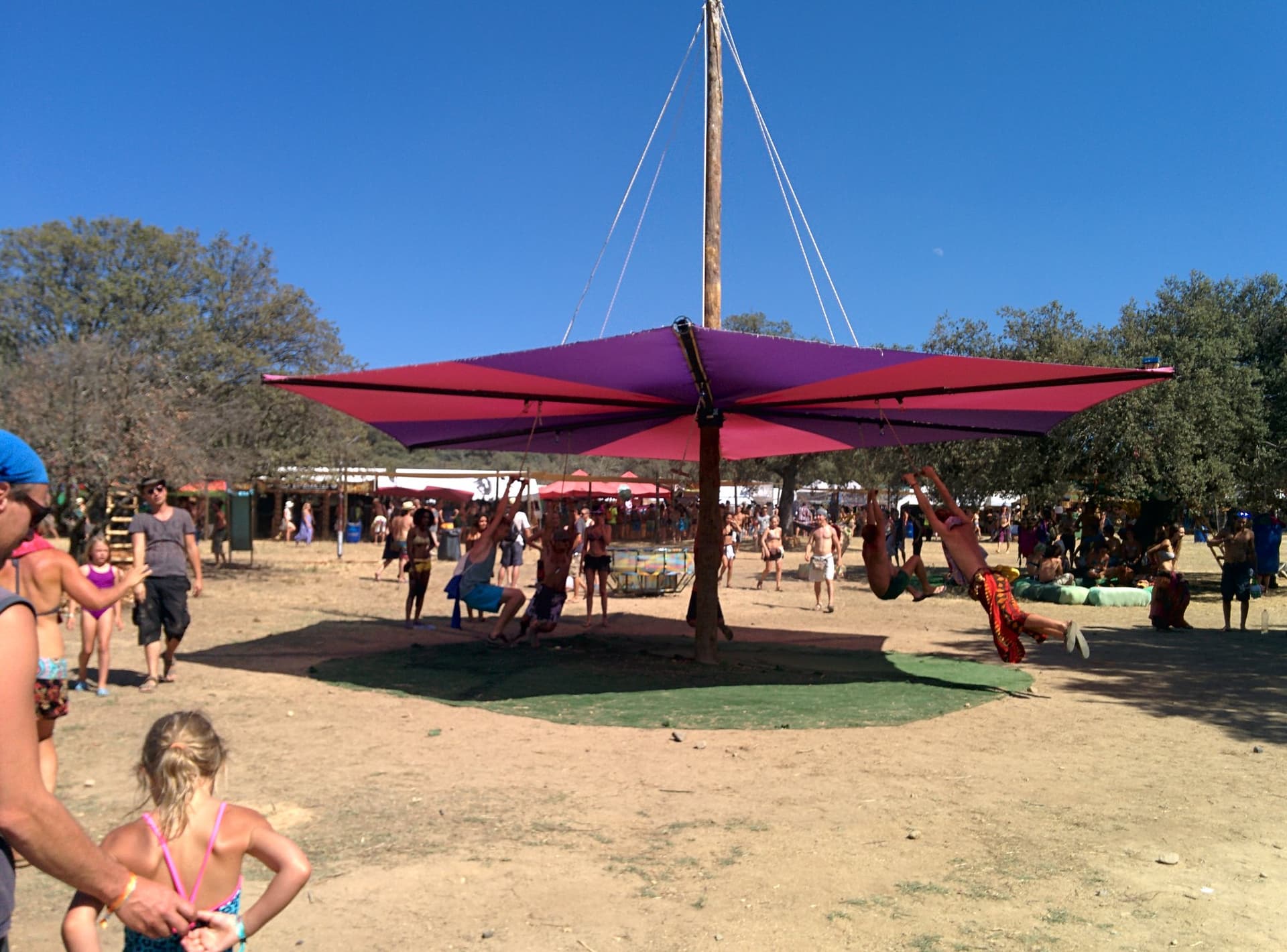 Resting under a red shade sail among the trees, Boom 2014
