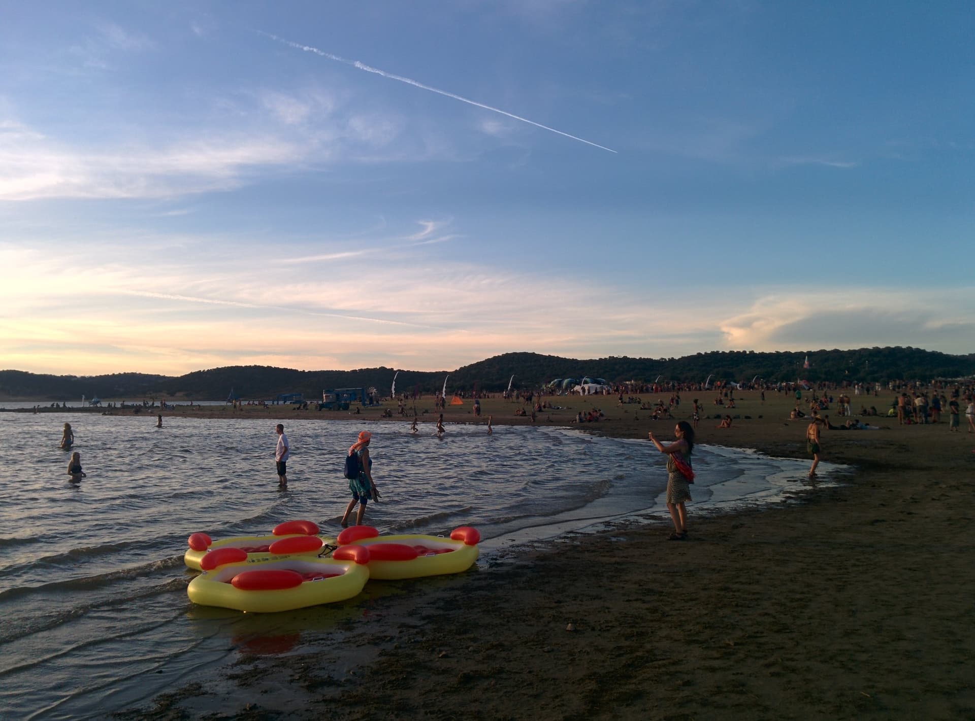 Inflatables and swimmers at the shoreline, Boom 2014