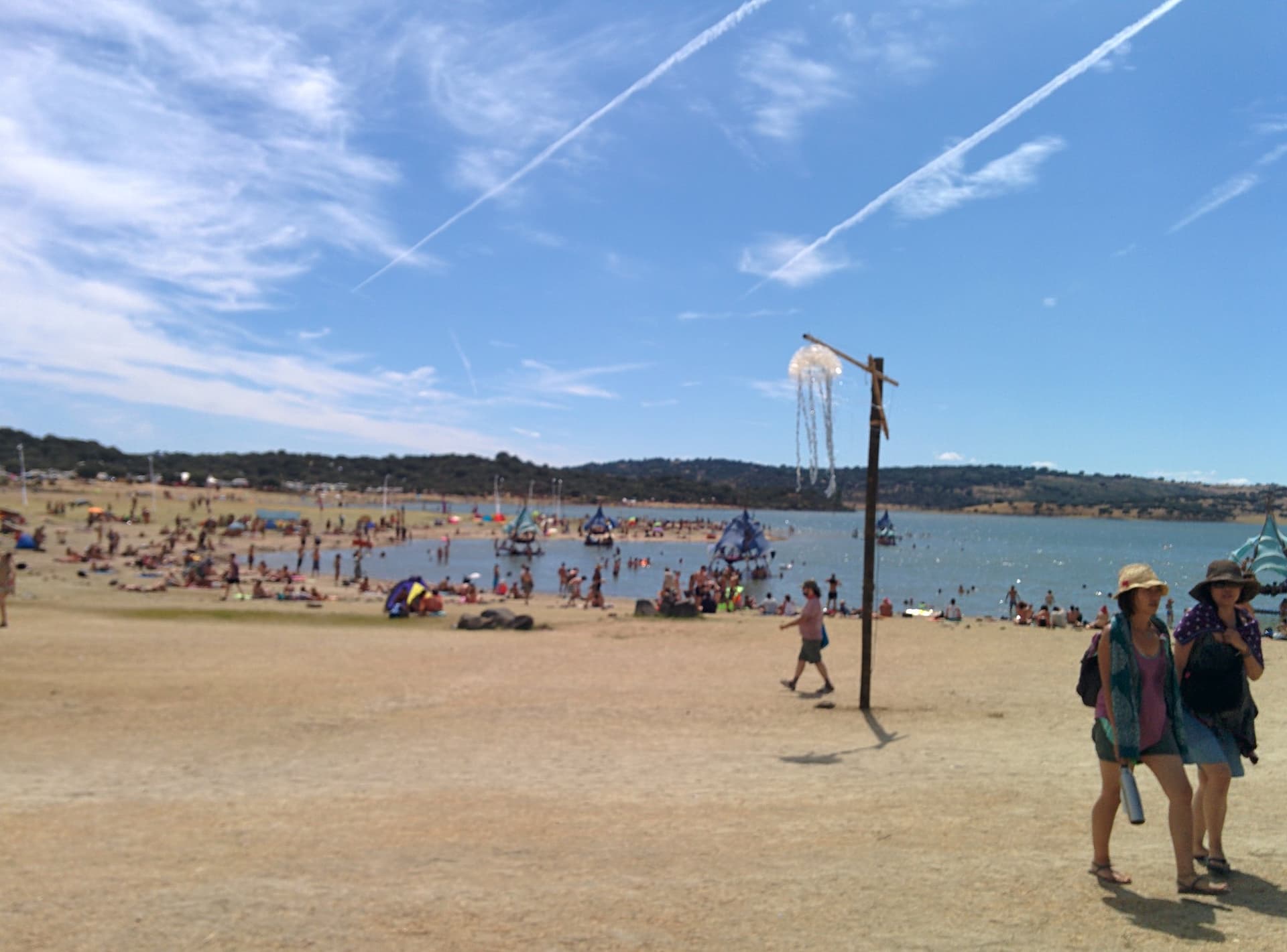 Beach shower and sunbathers by the water, Boom 2014