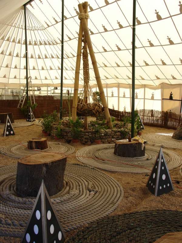 Liminal Village dome with seating stumps, Boom 2006