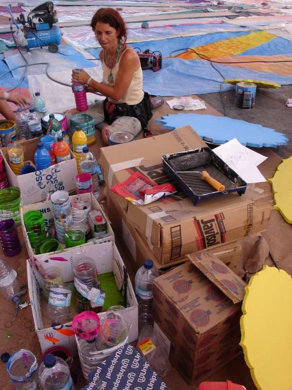 Artist mixing paint for decor panels, Boom 2006