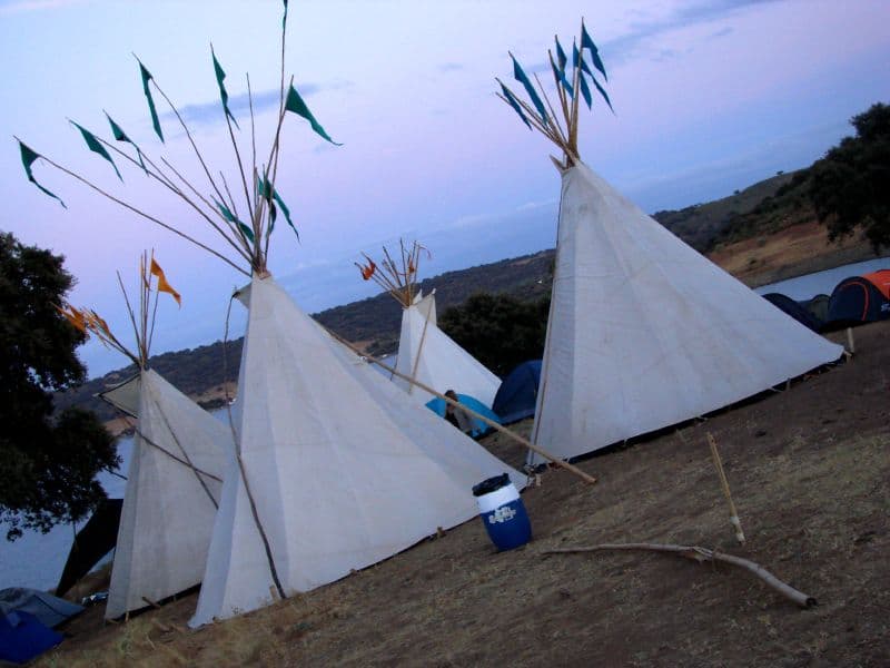 Tipis with pennants at dusk
