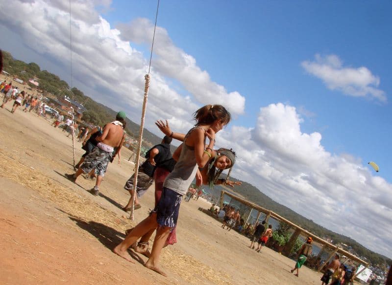 Visitors walking on the lakeshore beach