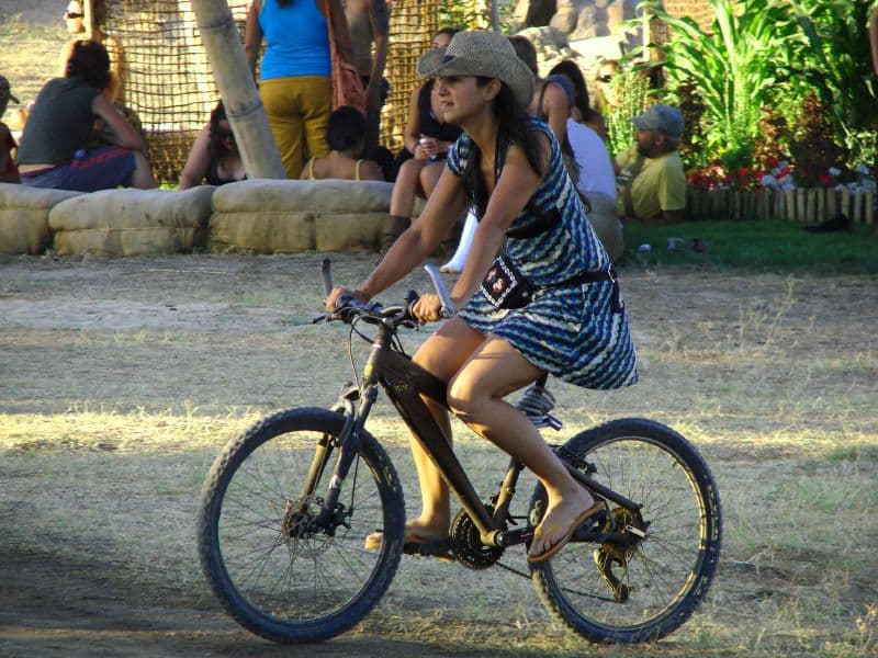 Cyclist riding past the straw bale wall