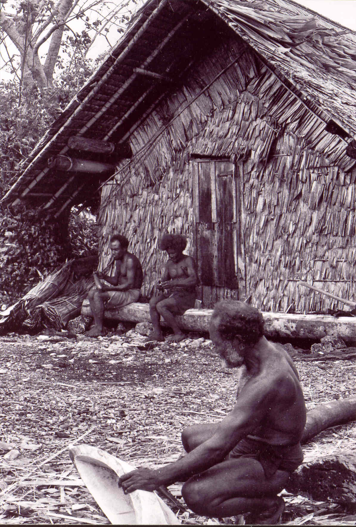 Rere priests outside the Kunua men's house