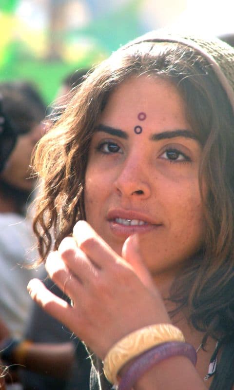 Visitor with a painted forehead mark