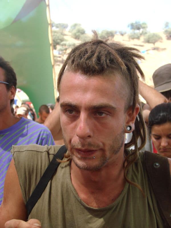 Visitor with dreadlocks and ear plugs