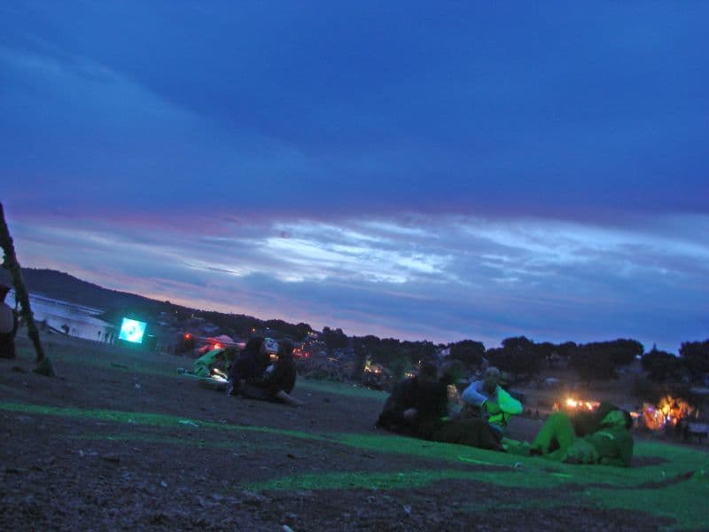 Campsite at dusk under a blue sky
