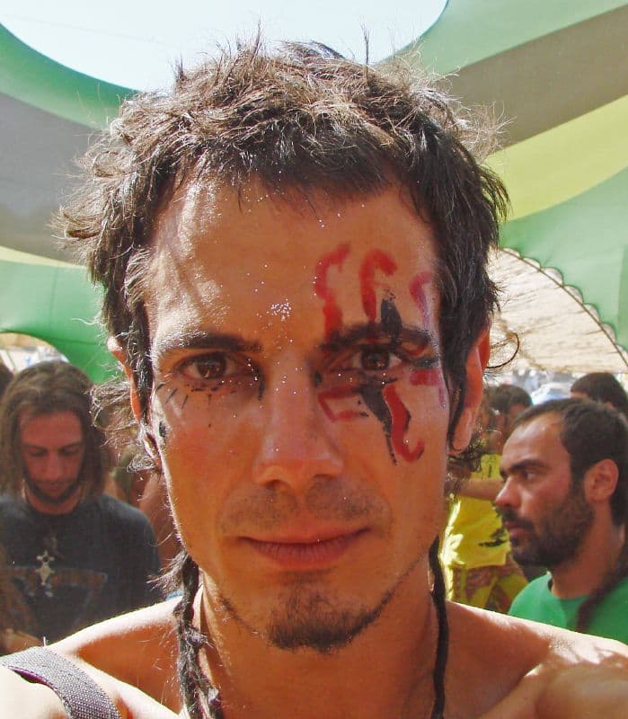 Visitor with red paint across his face