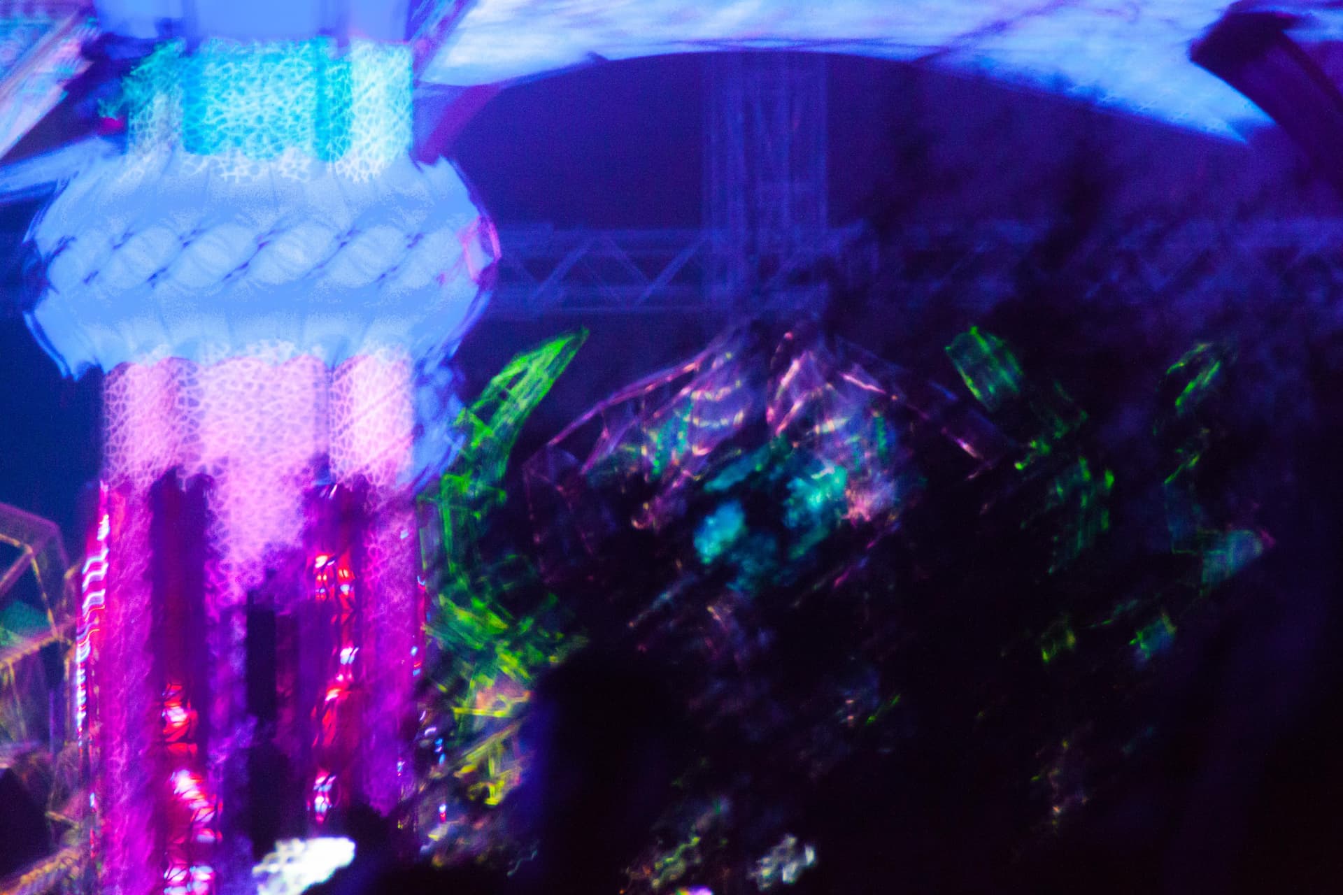 Stage lit in ultraviolet blue and green