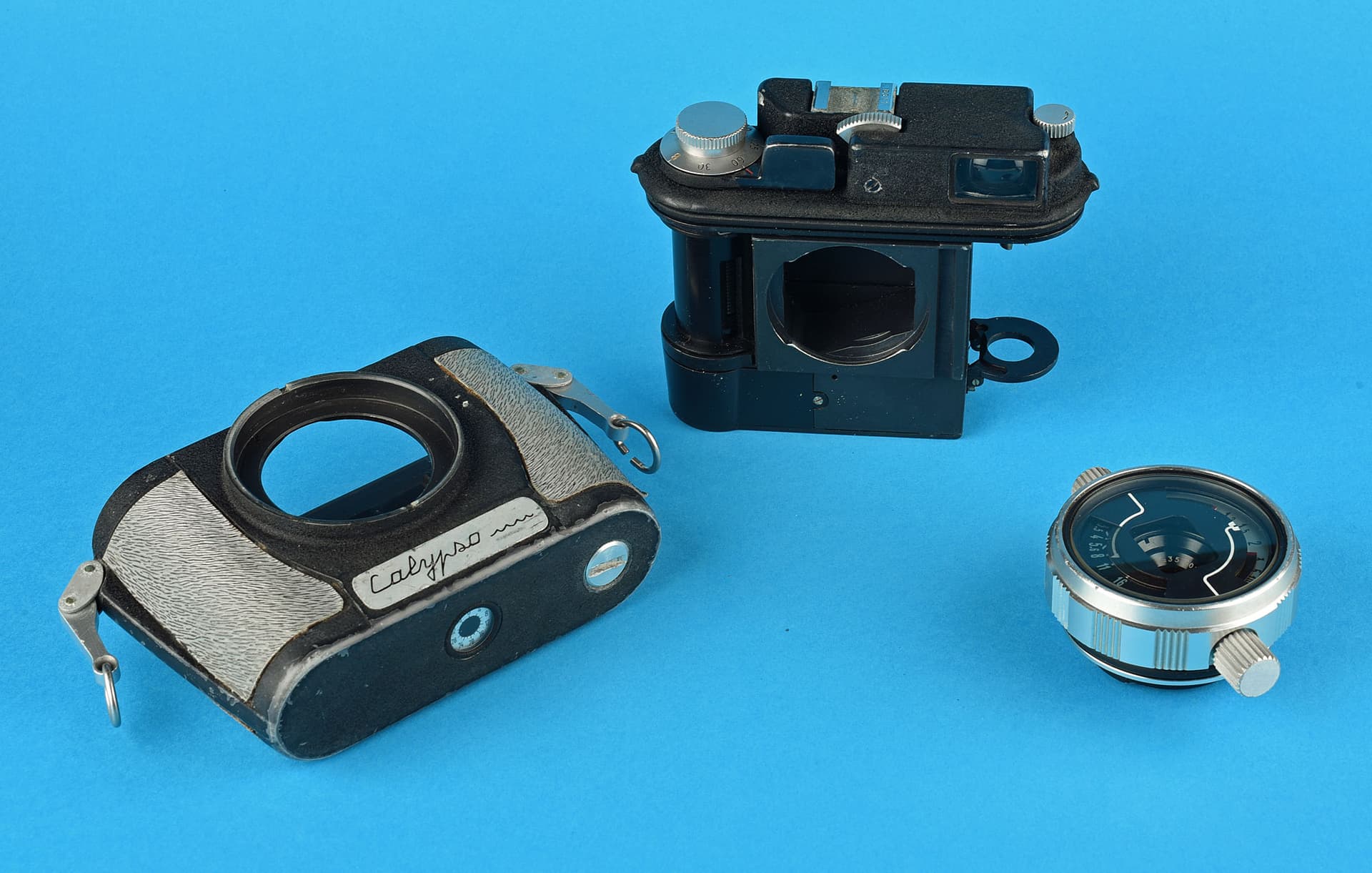 The Calypso camera opened, showing shell and mechanism