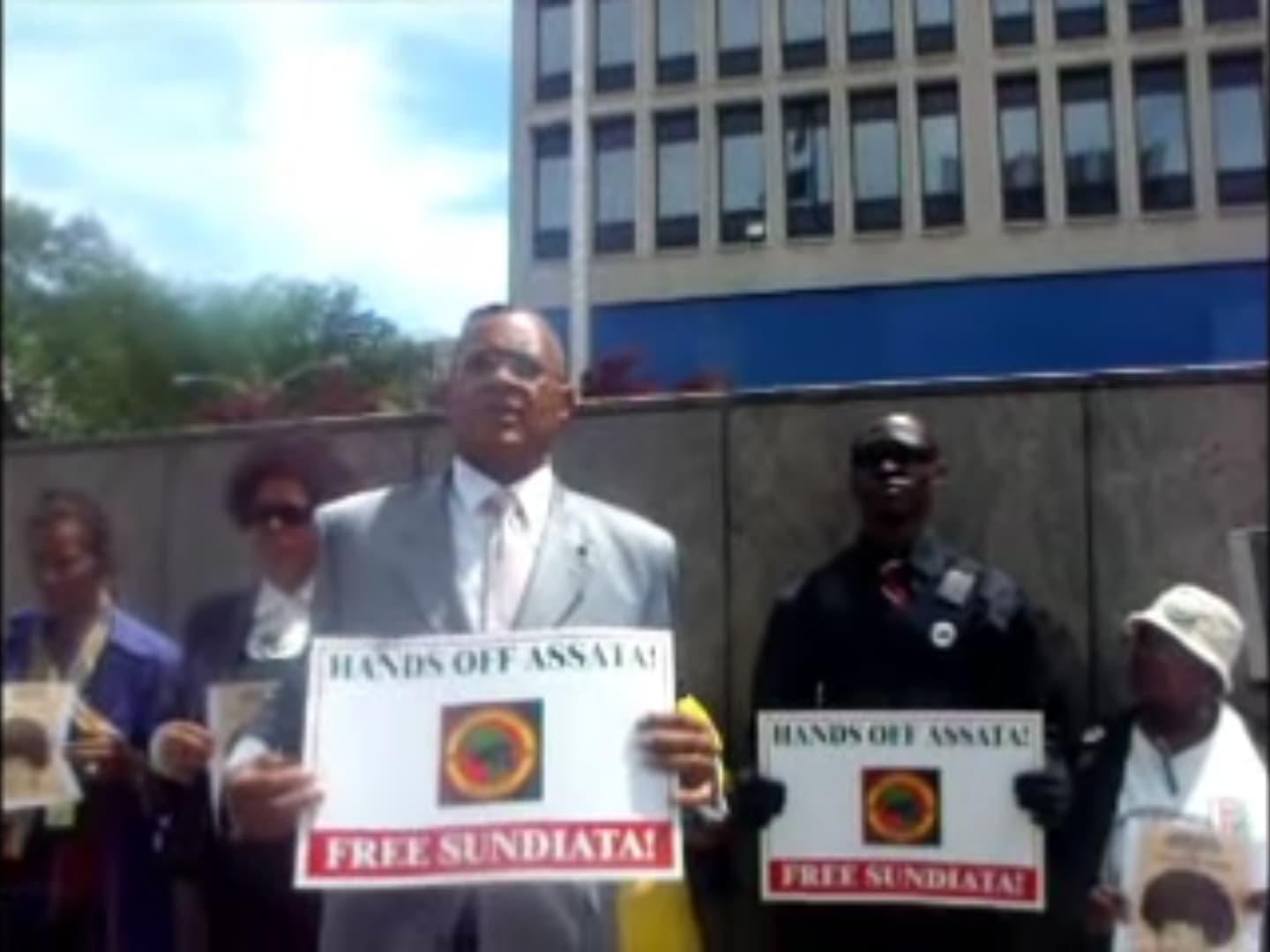 Demonstrators at a Hands Off Assata rally