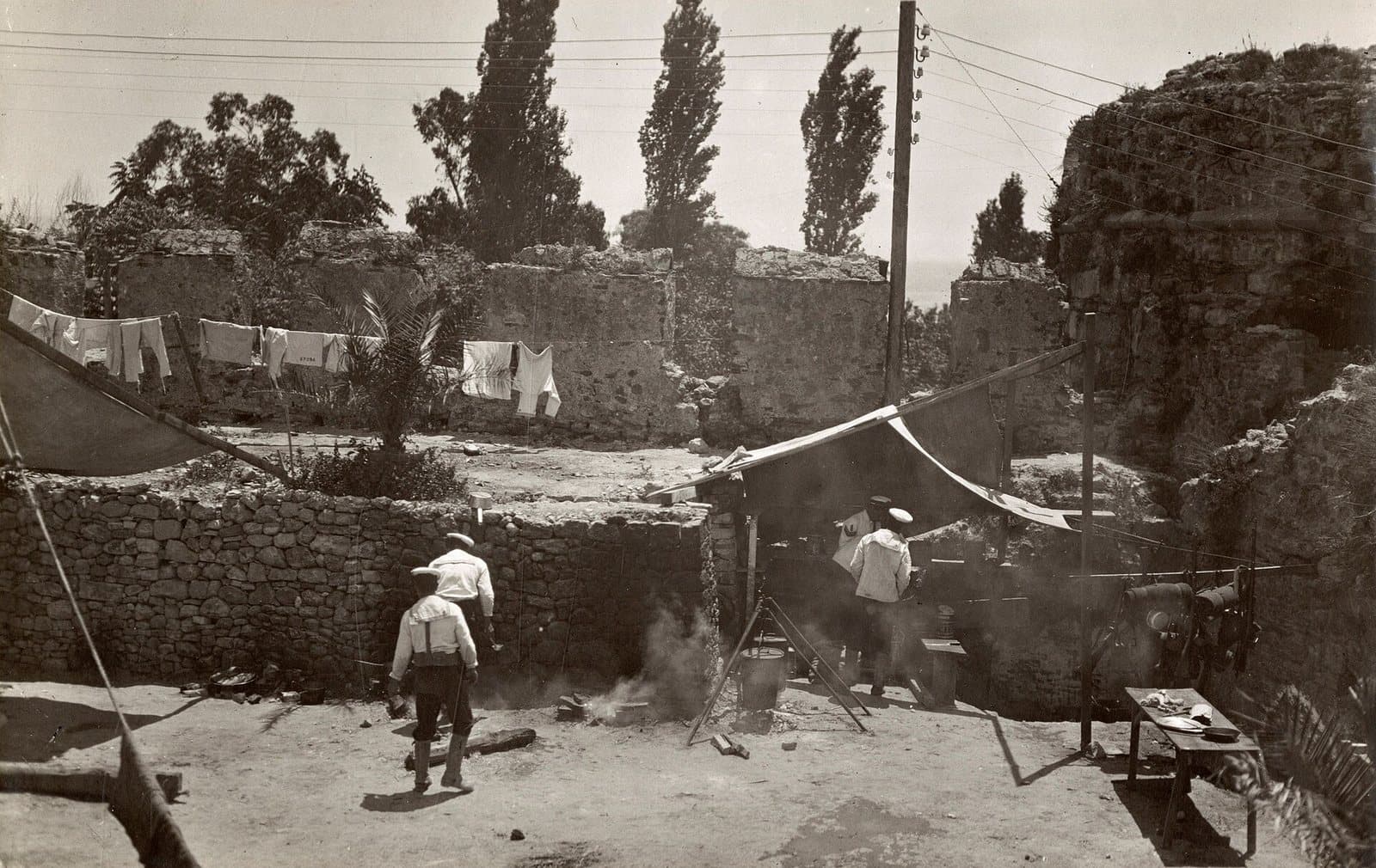 Soldiers cooking in the open behind the konak