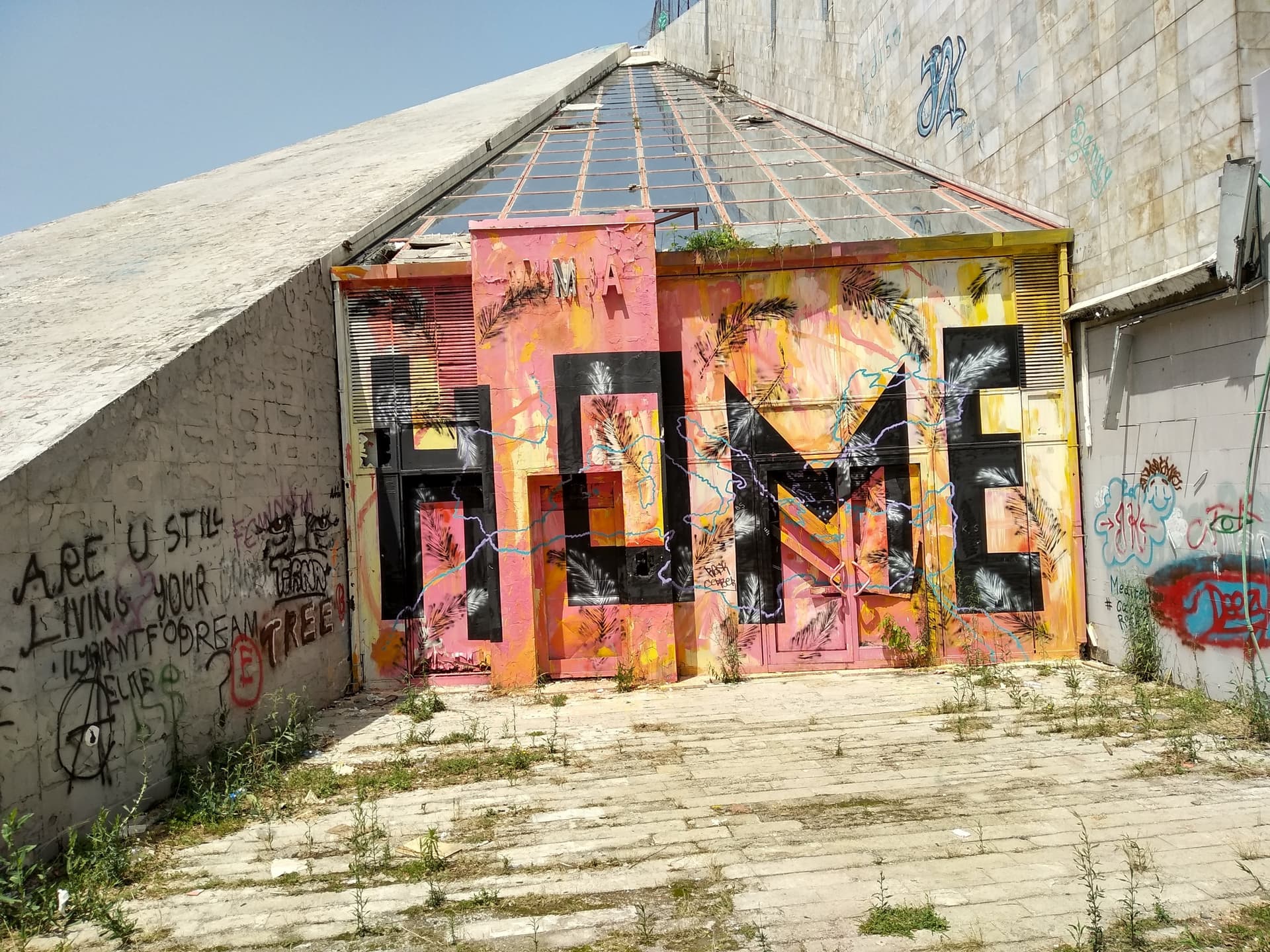 The Pyramid of Tirana - 'Home' graffiti before renovation