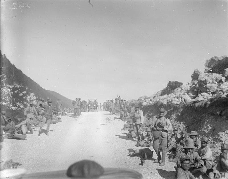 Italian troops resting on the coast road