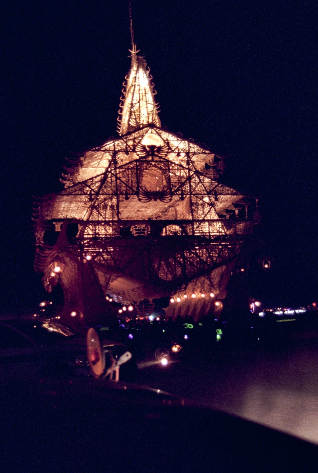 The Temple of Joy, lit at night · 1/7