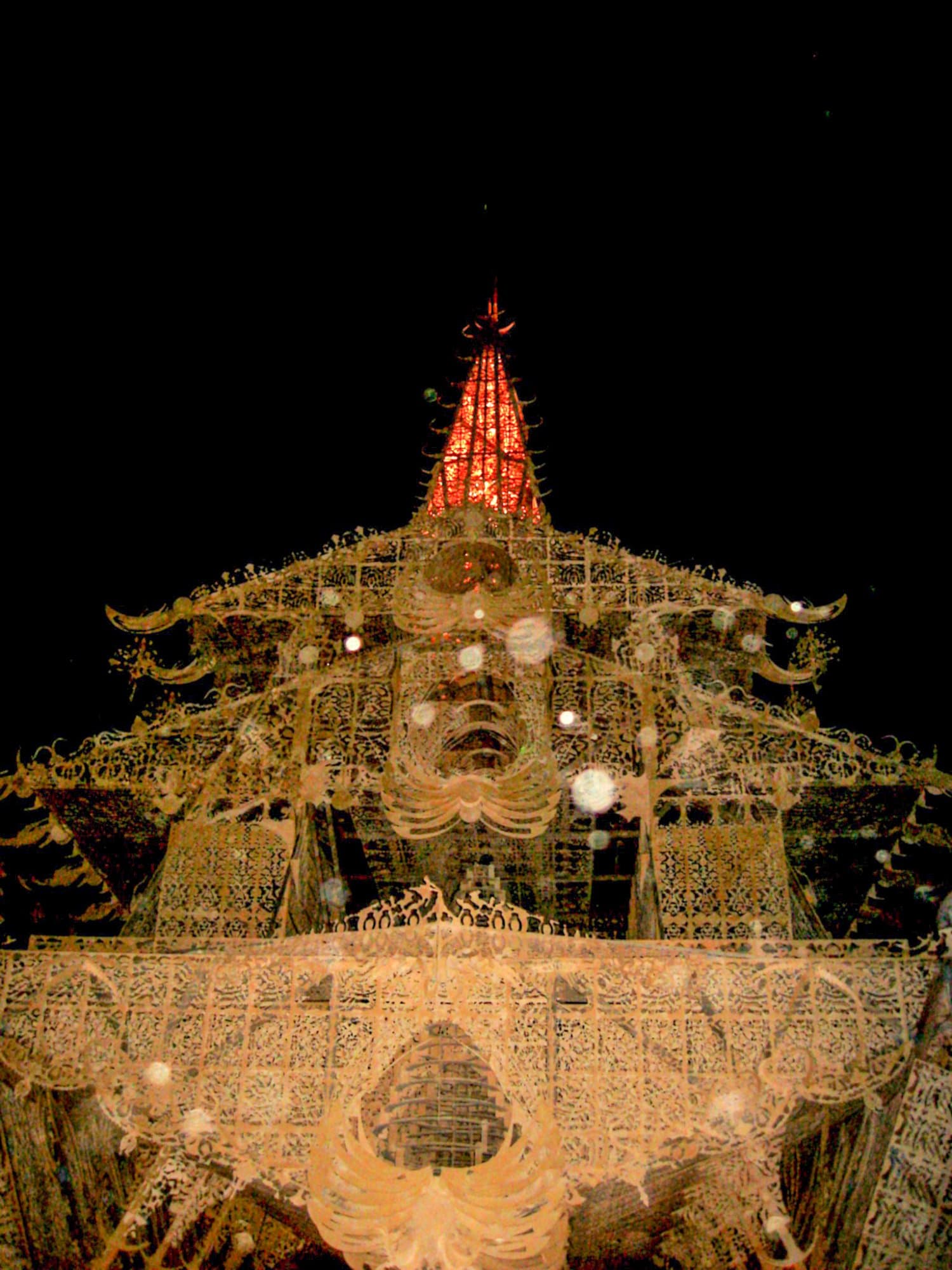 The Temple of Joy, lit at night · 6/7