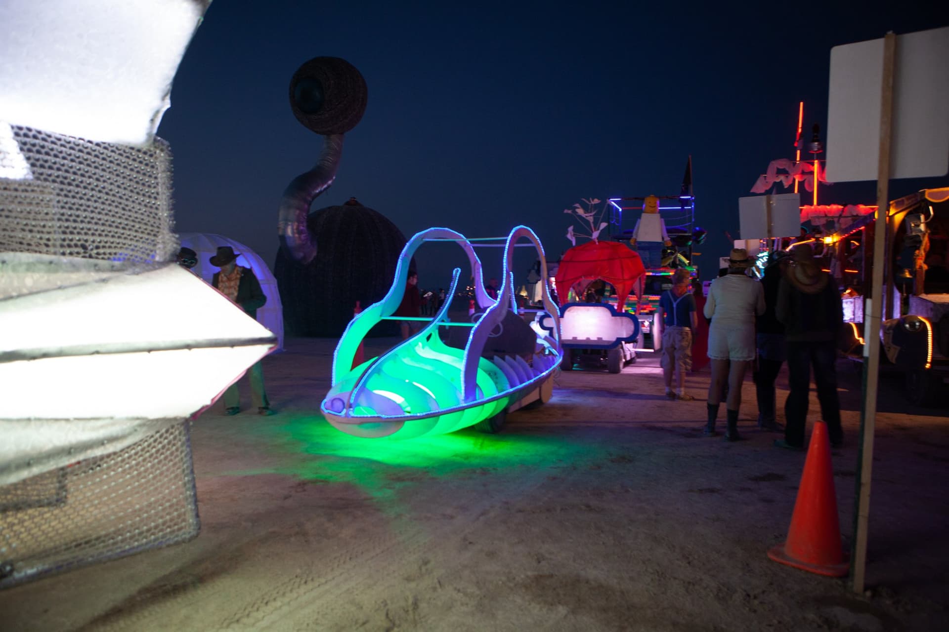 The neon art cars at night · 6/15