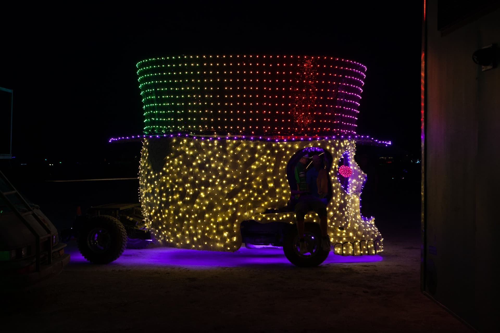 The neon art cars at night · 9/15