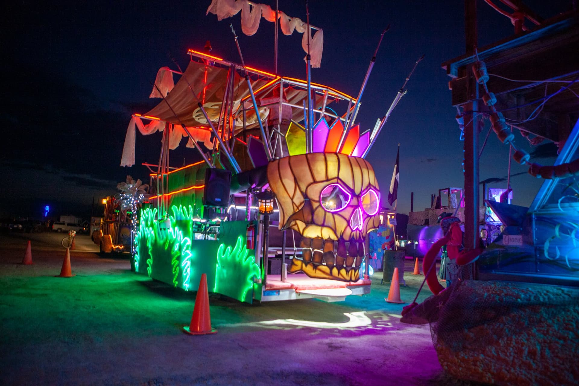 The neon art cars at night · 13/15