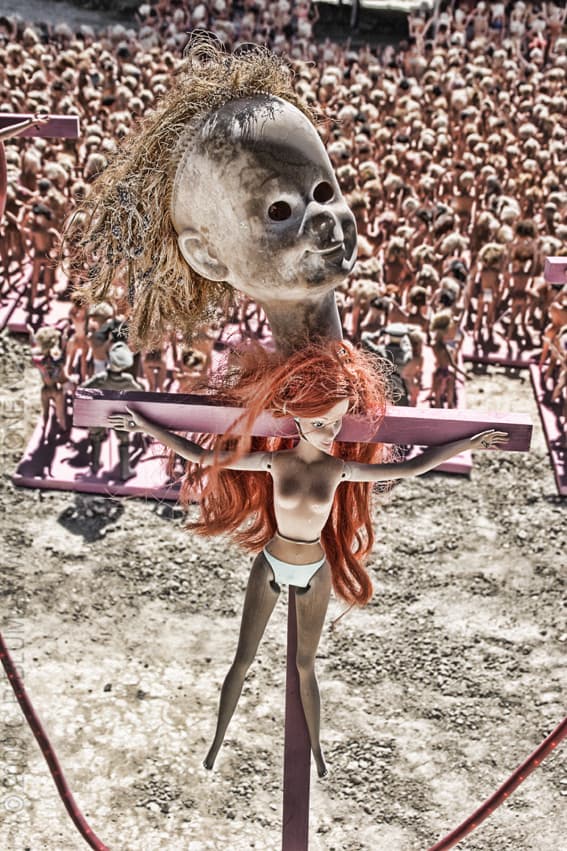 Crucified Doll Assemblage Over a Doll Crowd