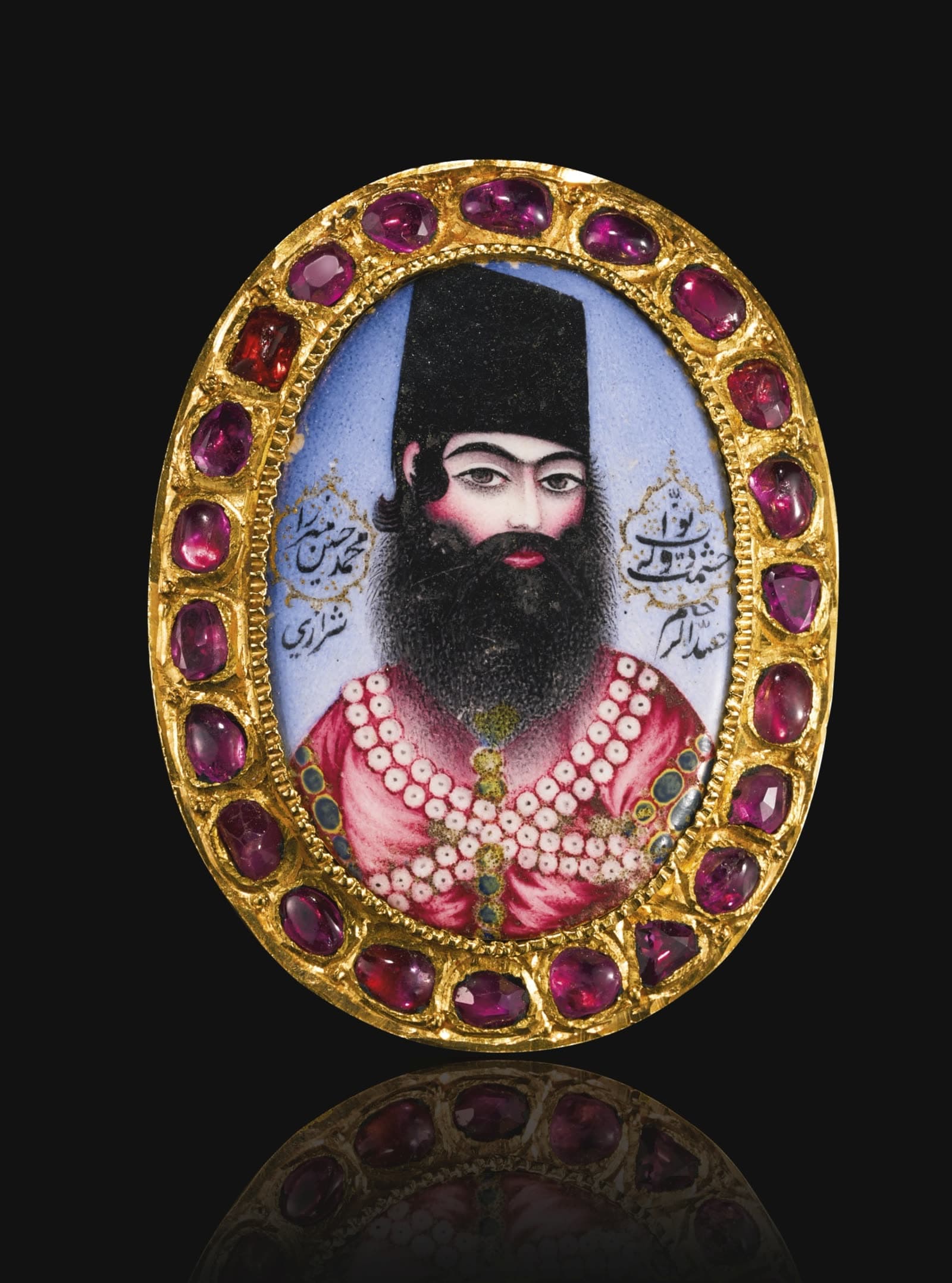 A Qajar enamelled and gem-set portrait medallion of Muhammad Husayn Mirza Hishmat al-Dawlah, Persia, early 19th century