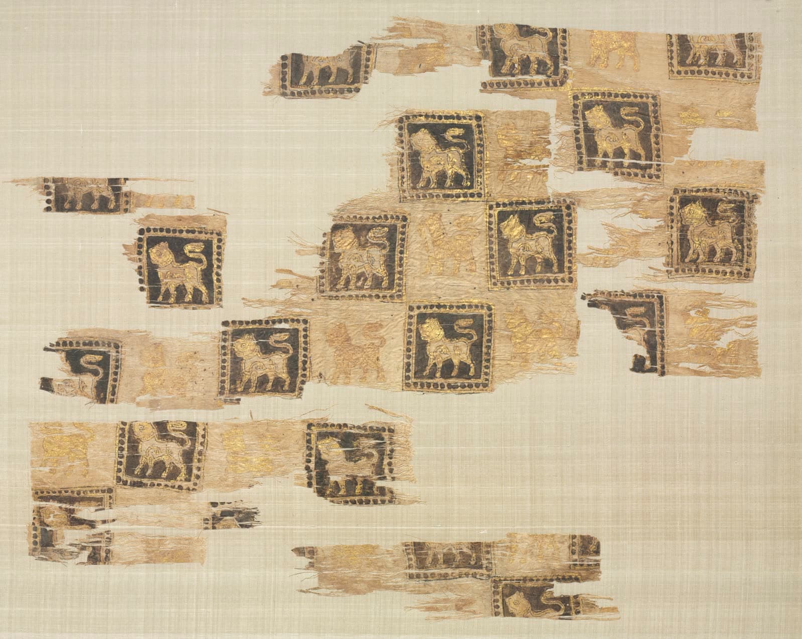 Fragment with gold leaf lions