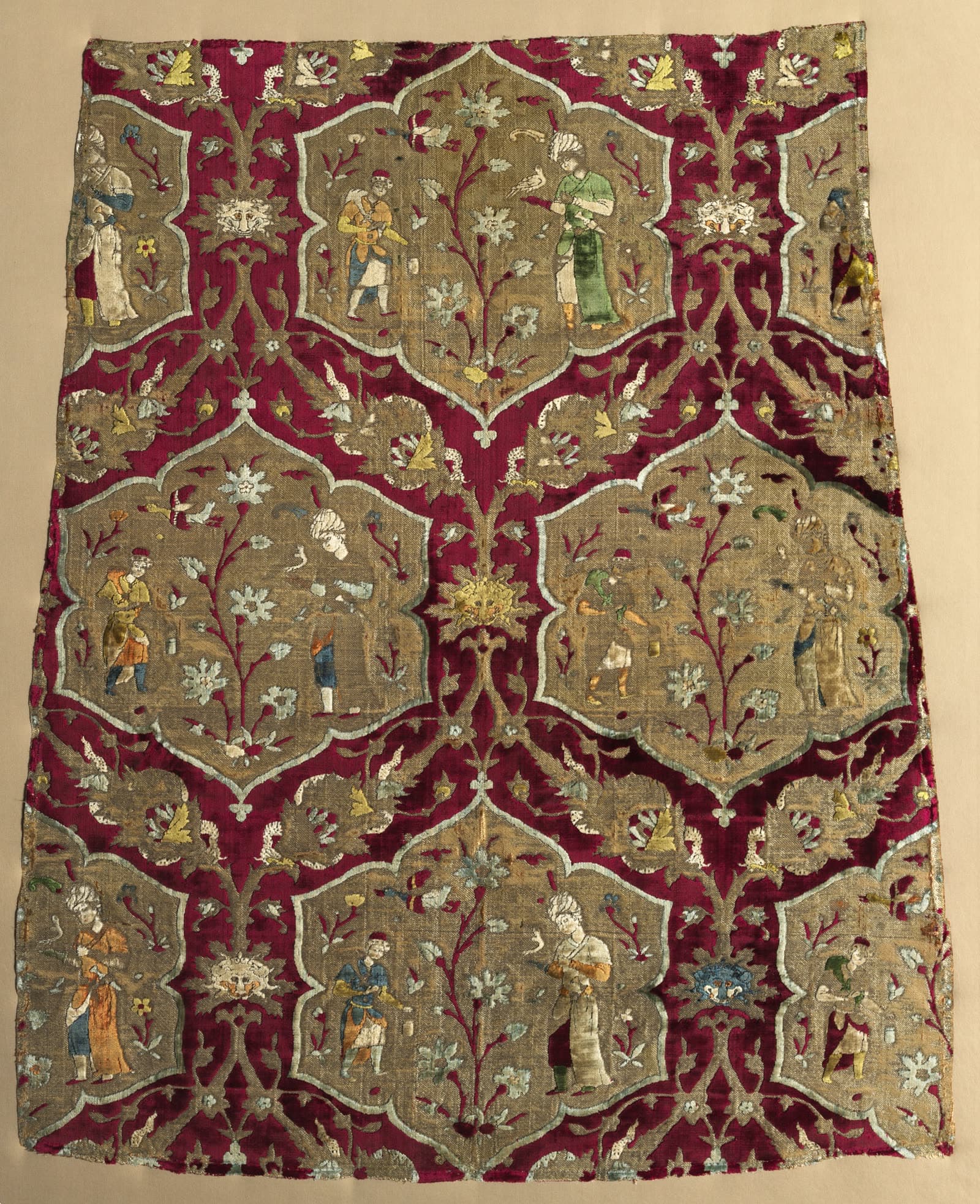 Fragment with falconer and attendant in animated lattice, from a robe