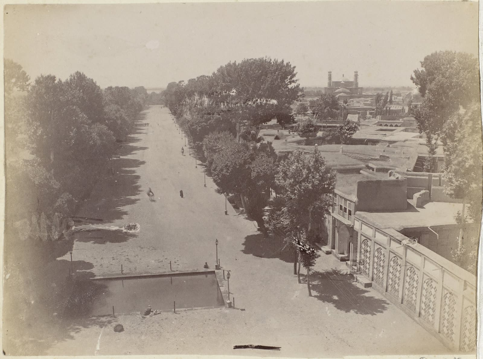 Qazvin, with a boulevard at left and the Friday Mosque on the horizon