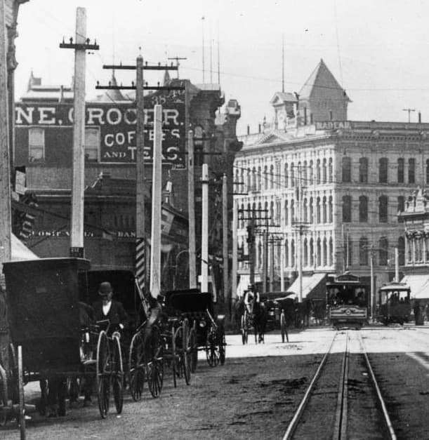 Jevne grocers on east side of Spring looking south from Franklin c.1893-6
