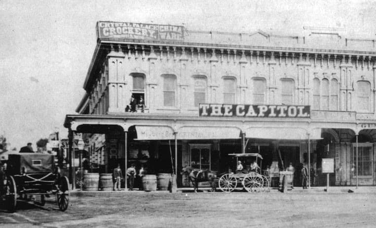 s view of the Downey Block located on the northwest corner of Temple and Main streets as…