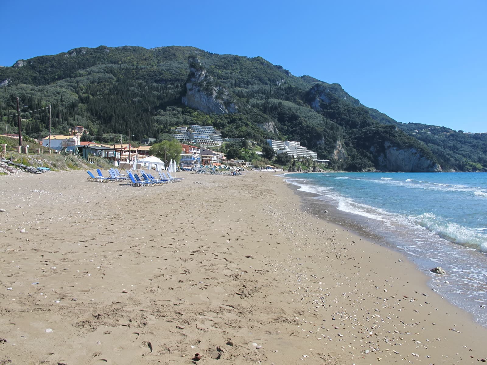 The sand and shallow water of Agios Gordios beach (6 of 6)