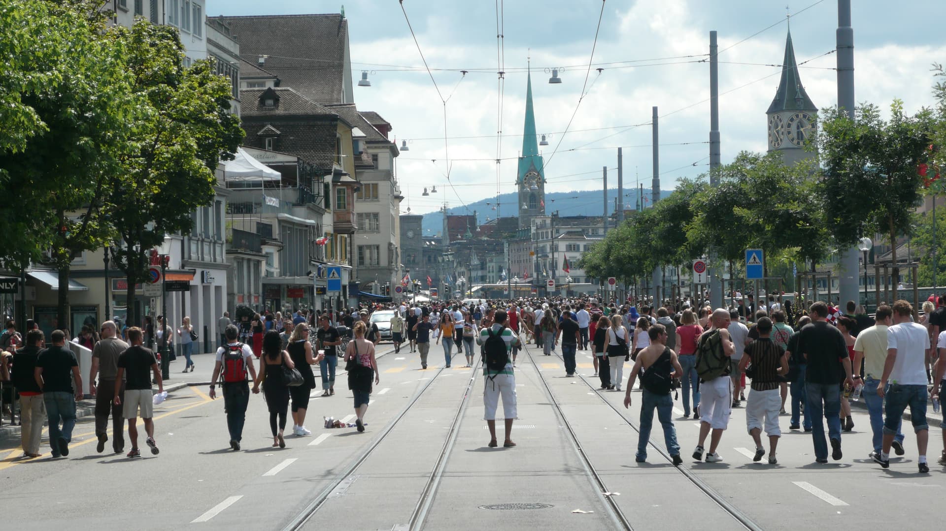 Wide avenue of the parade route filled with people, 2008