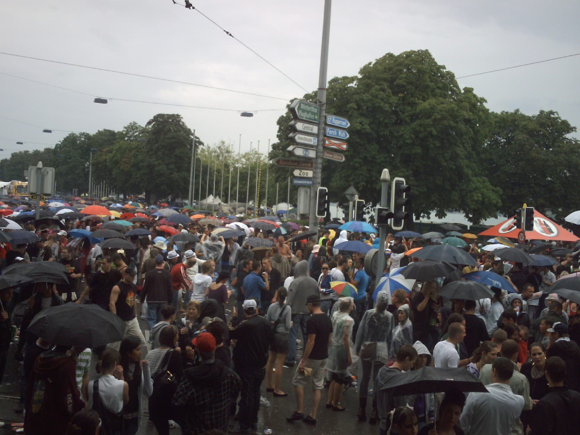 Umbrellas over the crowd in the 2009 downpour