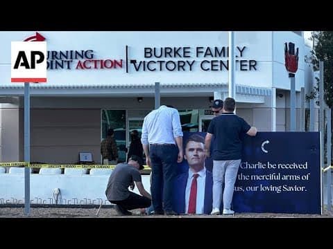 Supporters gather at a memorial outside TPUSA headquarters