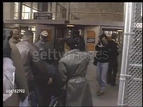 Tupac arrives at court in a wheelchair
